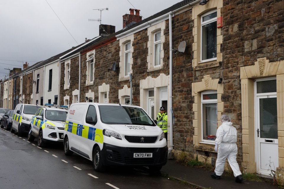 Police set up a cordon outside her home in Swansea