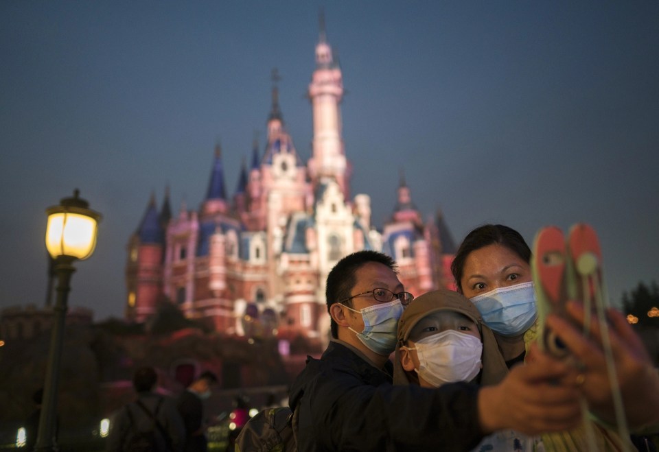 Tourists visit Shanghai Disneyland after its reopening on May 11, 2020