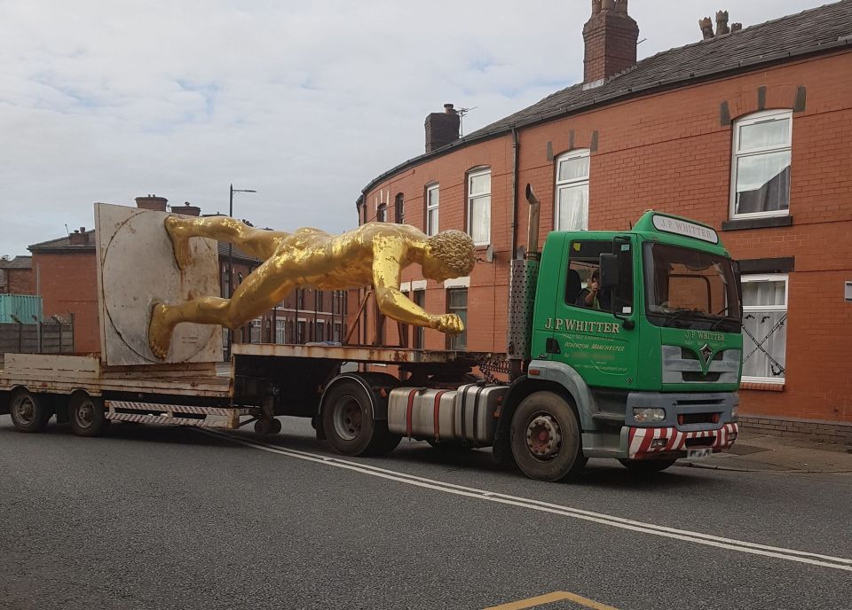 The golden statue was towed away from outside Grant's shop