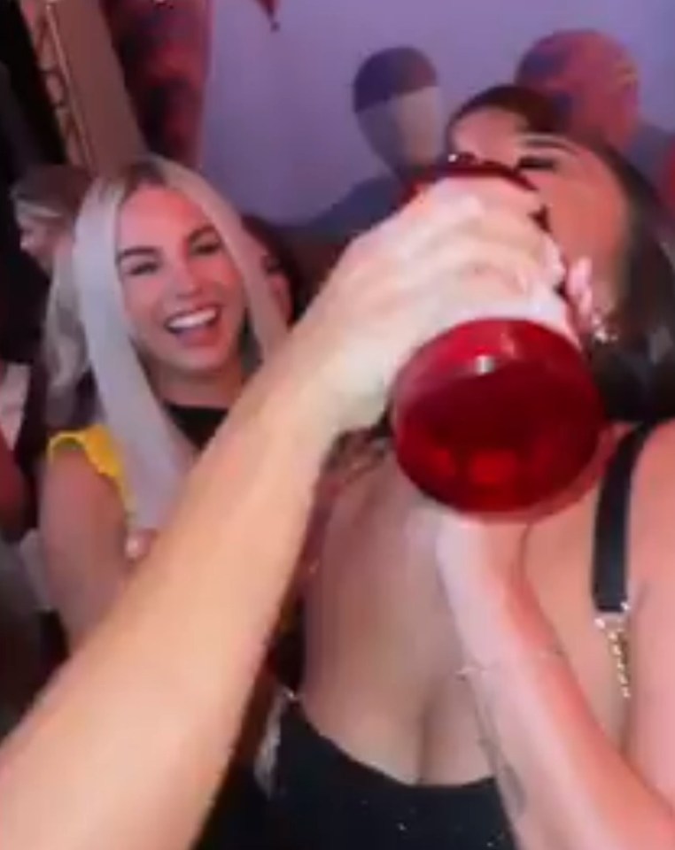 Ekin-Su poured drinks into Paige's mouth during the wild bash