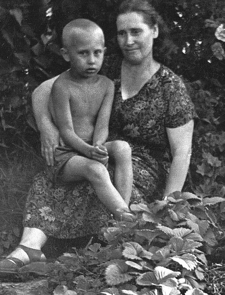 The boy who would be king....Putin aged 5 in the arms of his mum Maria