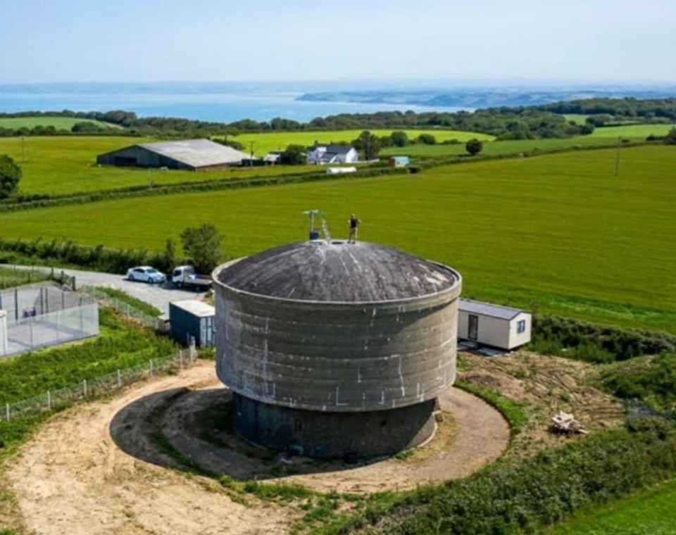 How the concrete water tower looked when Rob bought it