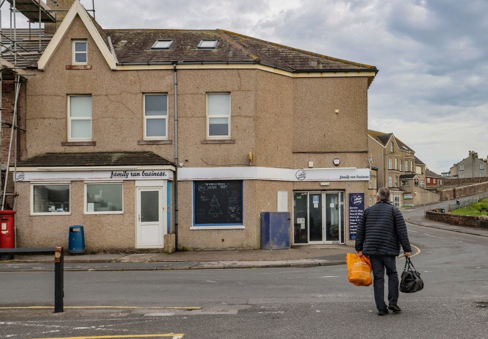 Shops along the seafront look rundown and empty