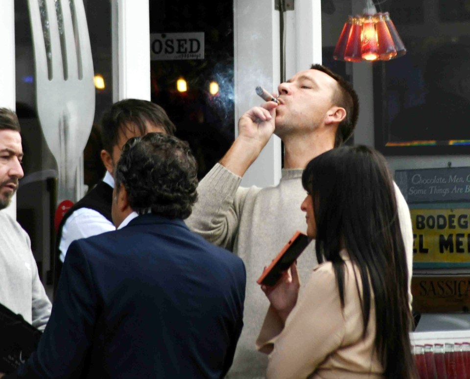 Terry was spotted outside of a fancy diner in the capital as he puffed on a cigar