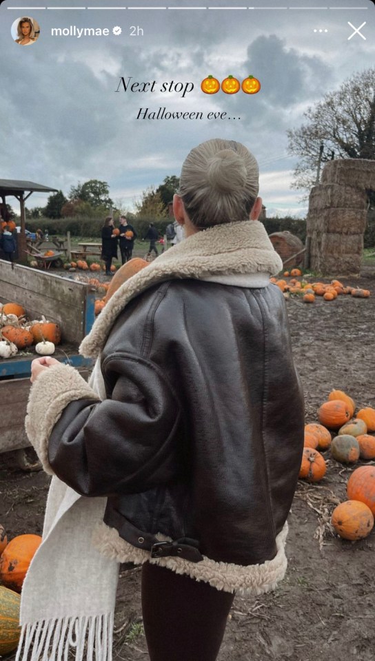 Molly kept wrapped up in a large coat for the Halloween outing