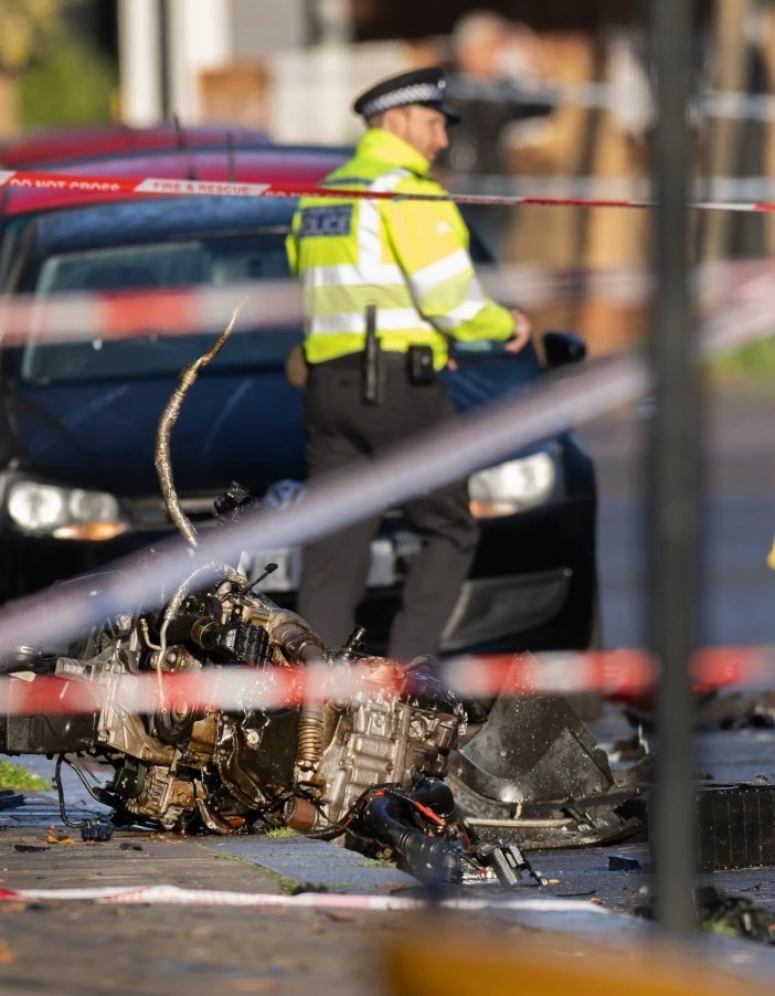 Cops were still at the scene this morning among the wreckage where an engine was ripped out by the force of impact