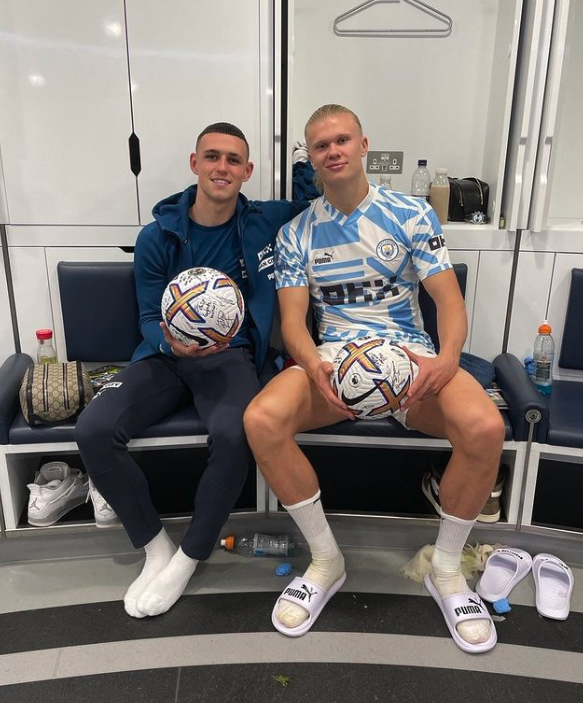 Foden and Haaland pose with their match balls