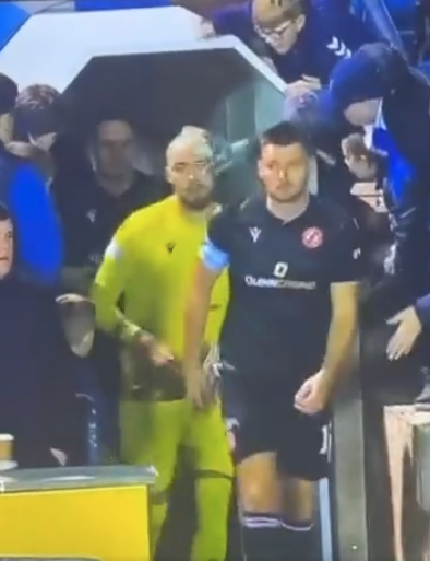 A Kilmarnock fan was seen slapping Dundee United players with goalie gloves