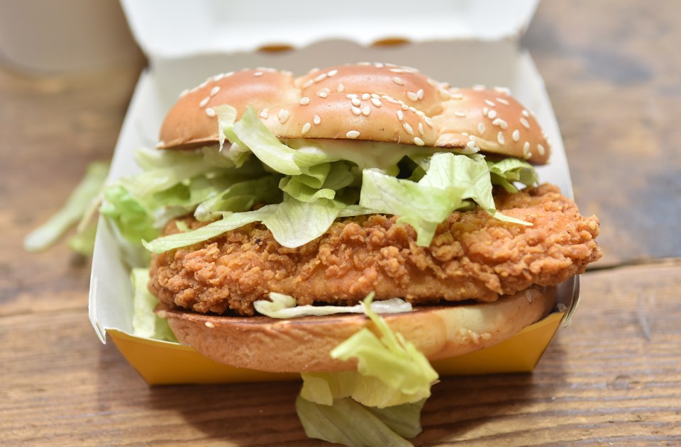 The burger comes between sourdough bread, with black pepper mayo and lettuce inside