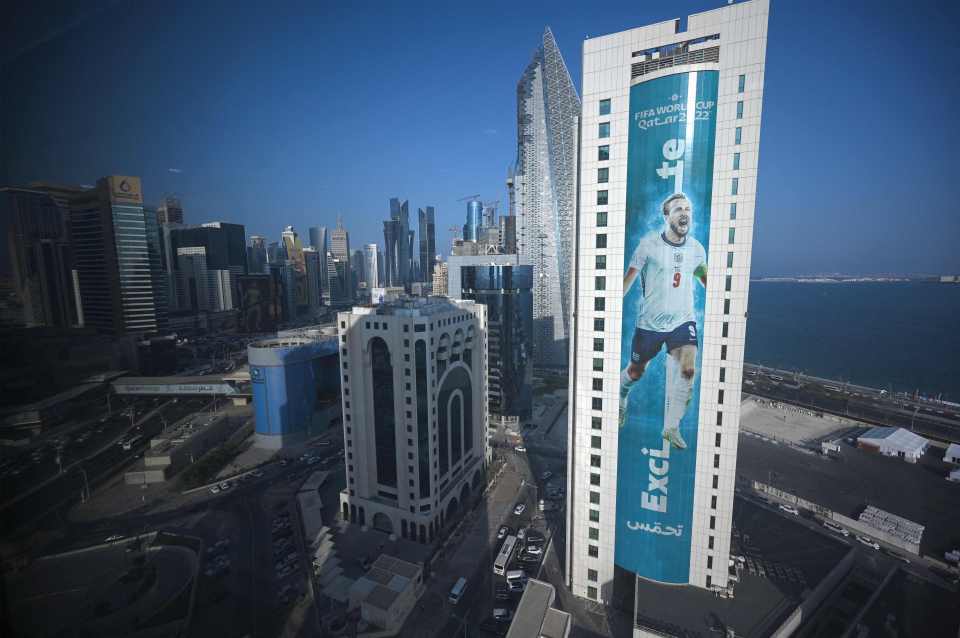 A banner of Harry Kane hangs alongside a building in Doha, Qatar