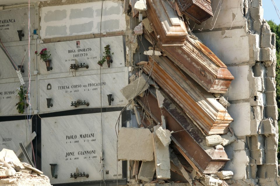 Caskets were left dangling mid-air following a disaster at an Italian cemetery