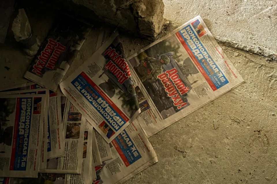 Newspapers from the early days of the war still laying on the ground