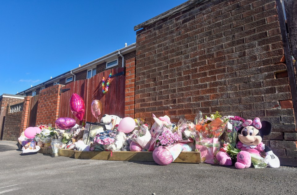 Heartbroken locals left tributes outside a property on Milton Grove