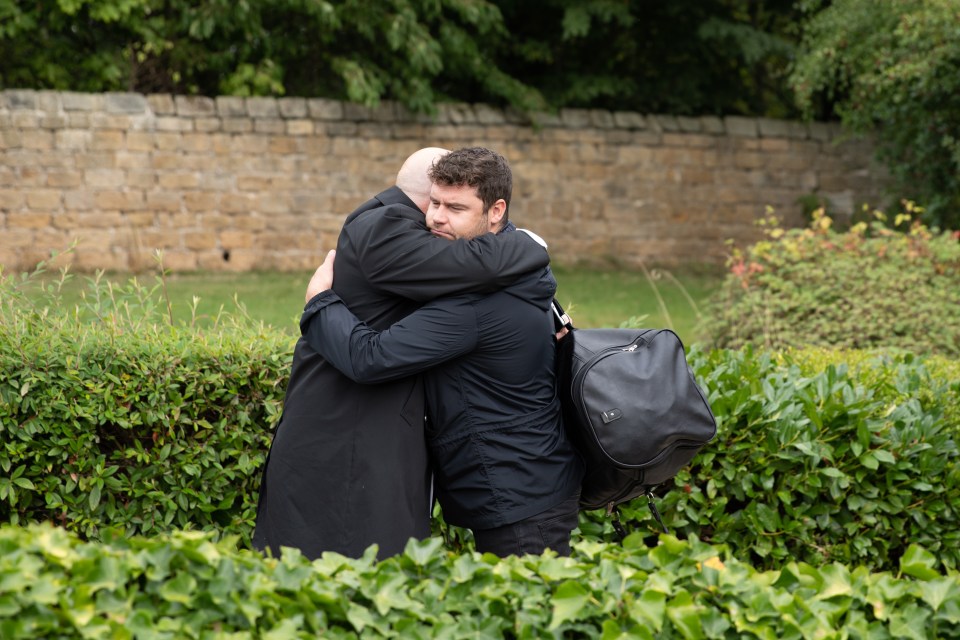 Aaron and Paddy hug before he leaves the village