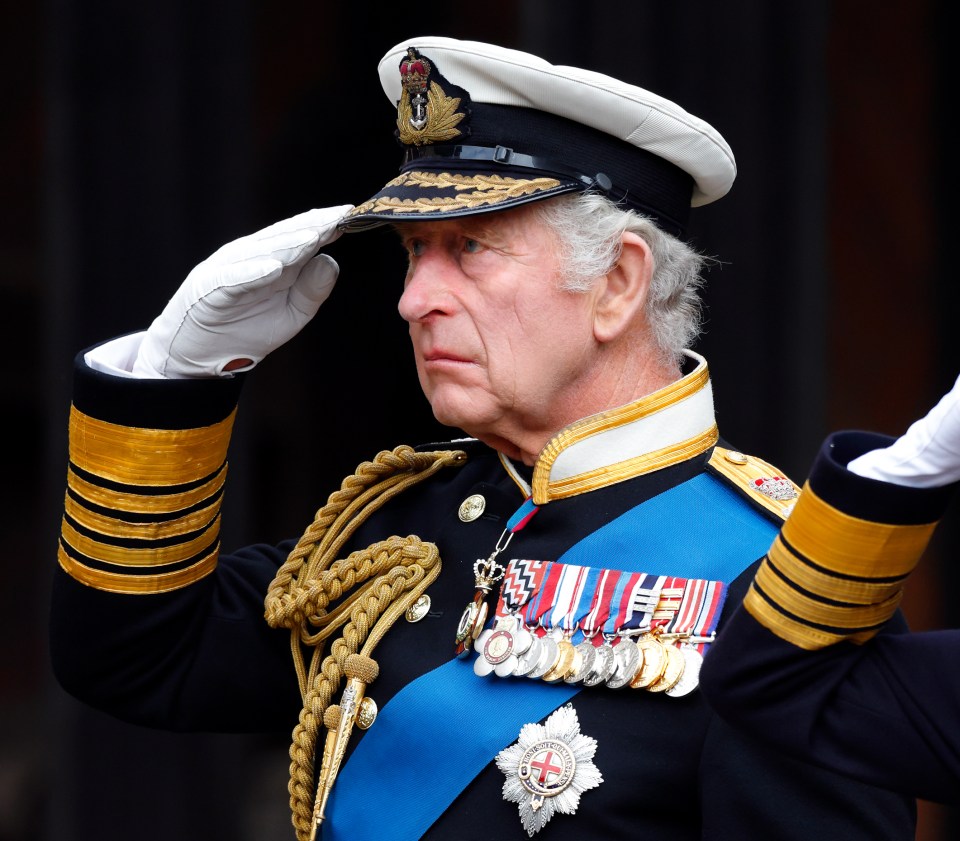 The King salutes his late mother at her funeral on September 19