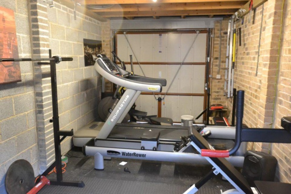 Carl’s garage is filled with gym equipment