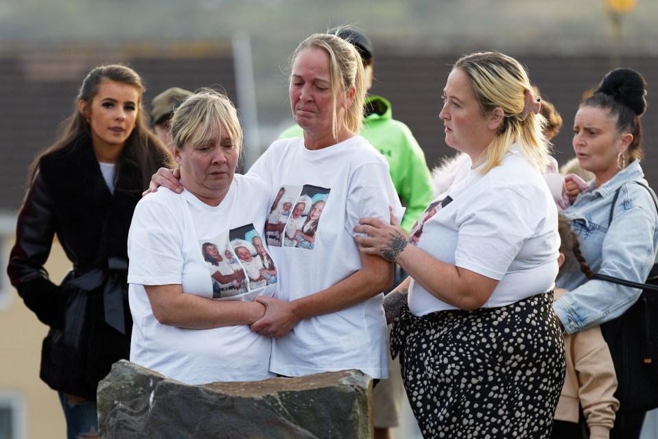 Mary (centre) with relatives and friends at the vigil