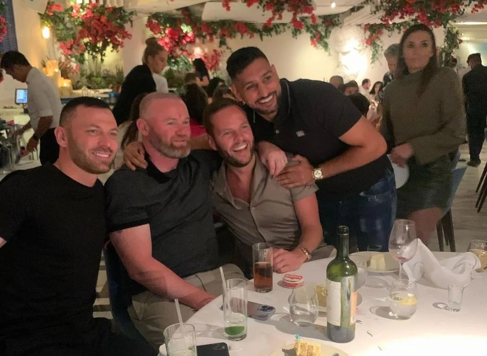 Former Manchester United team-mate Phil Bardsley (left) havning dinner with Rooney