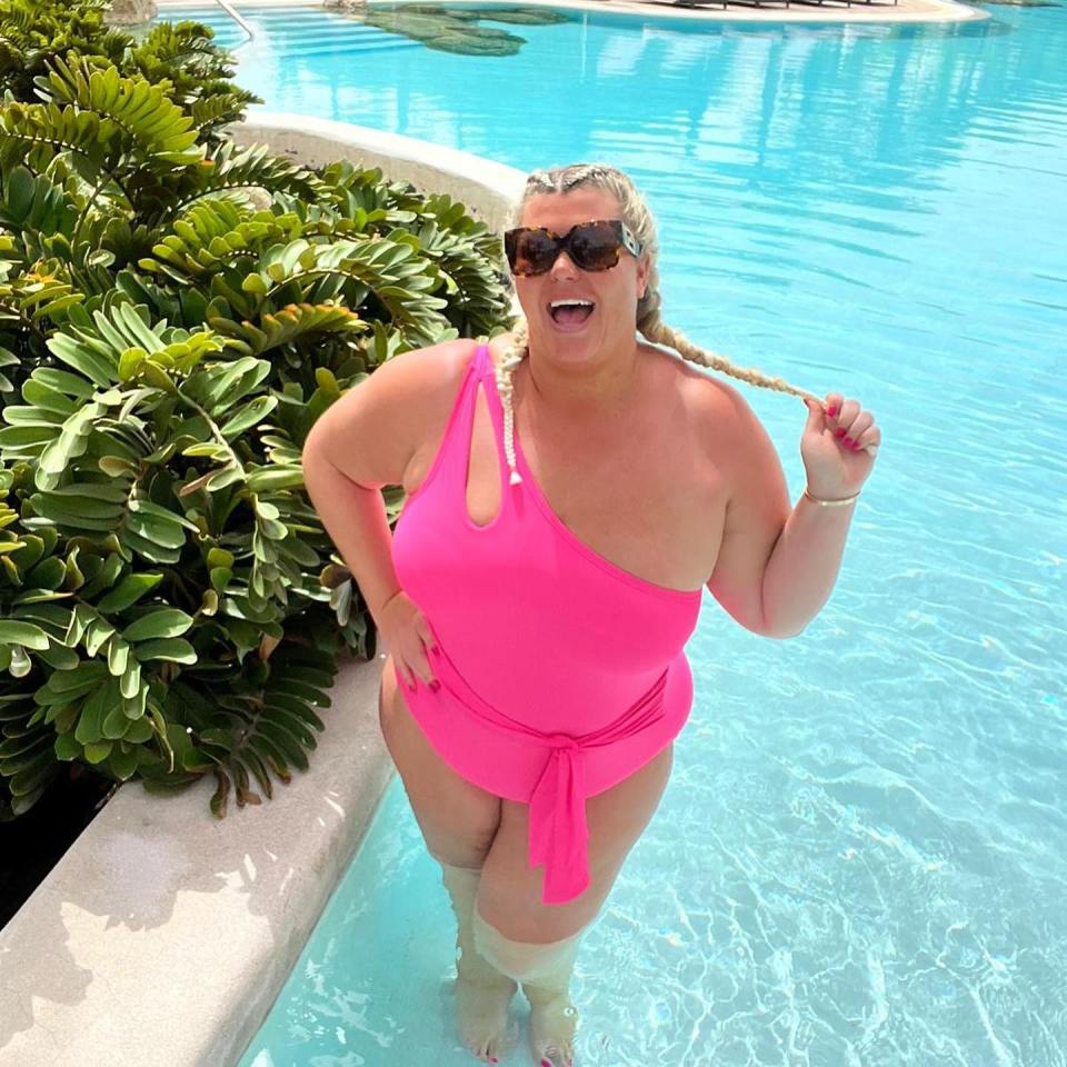 Gemma showed off her shrinking figure in a pink neon swimsuit