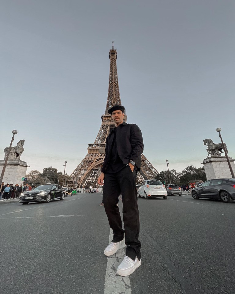 The couple posed for pictures by the Eiffel Tower