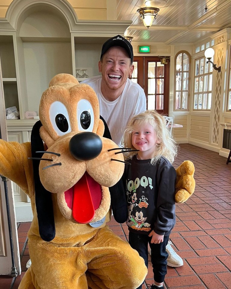 Rex posed for a picture with Pluto and his dad Joe