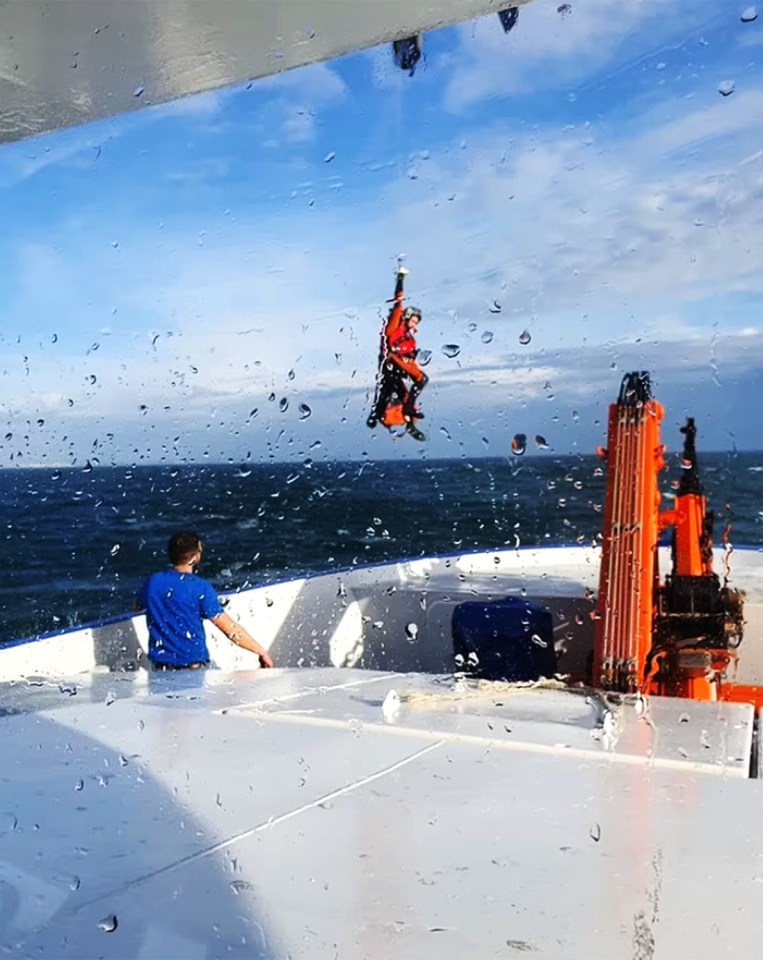 The man pictured being lifted off the fishing boat and taken to hospital