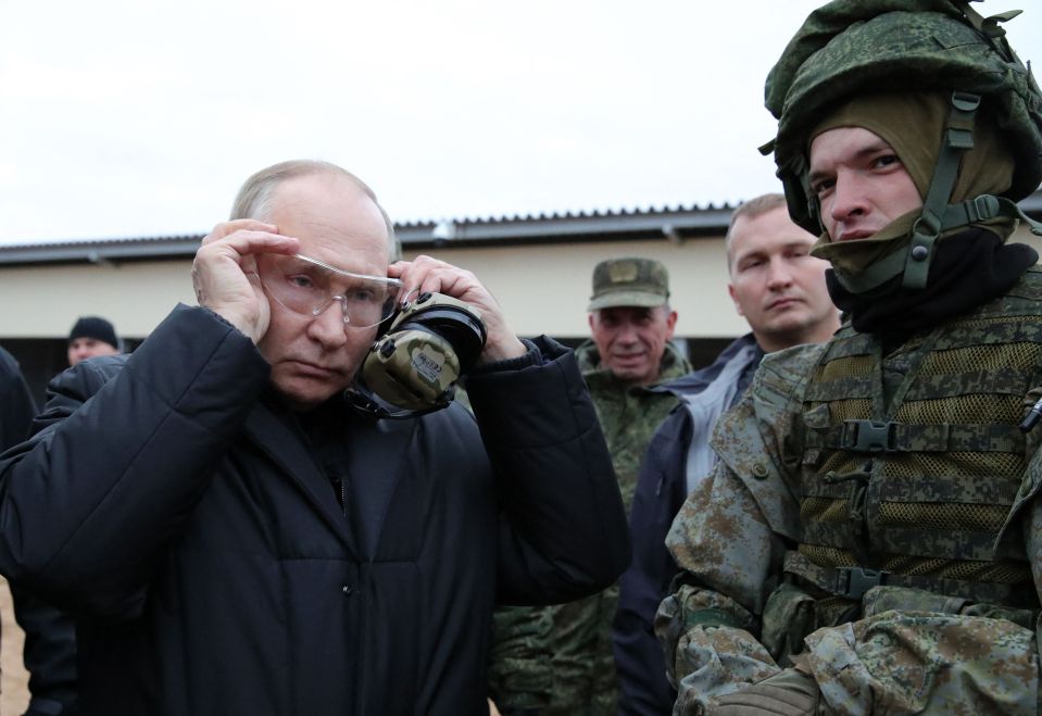 Putin meets soldiers during a visit at a military training centre near the town of Ryazan