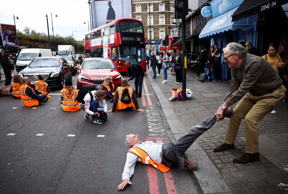 Activists glued themselves to the road in London today