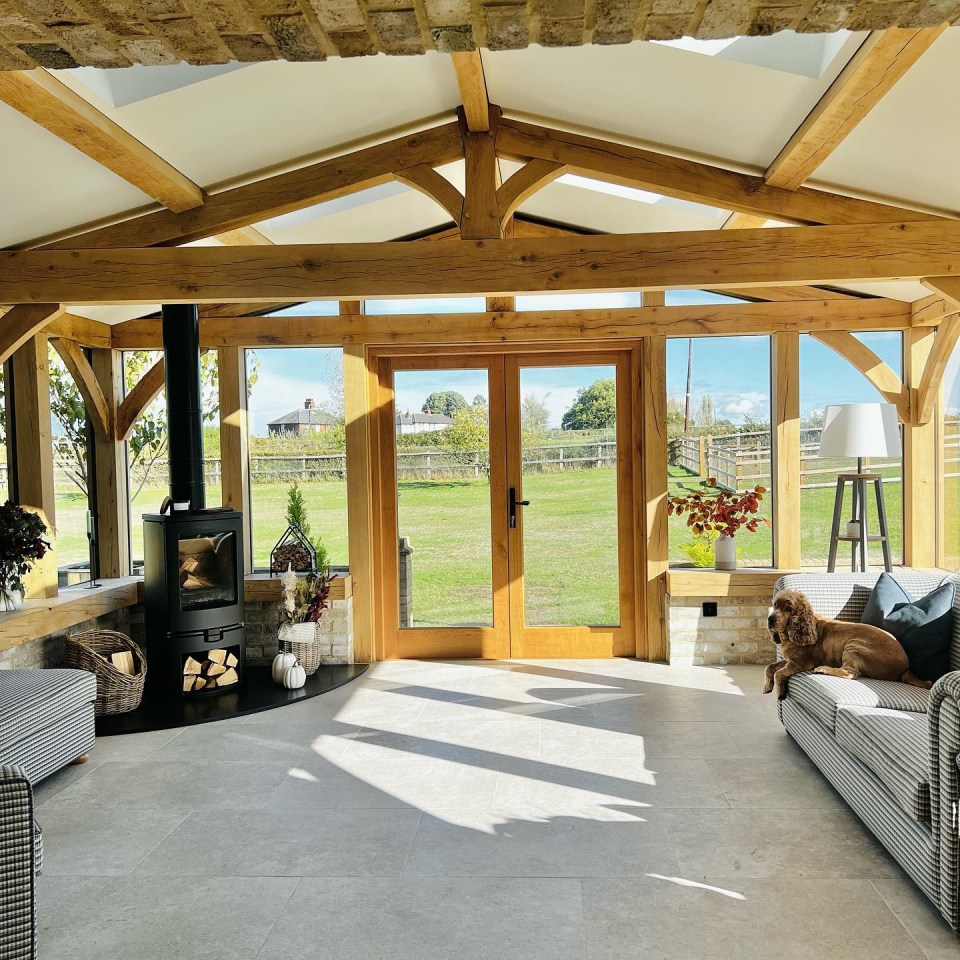 The room at the end of the kitchen features a stunning view of the garden