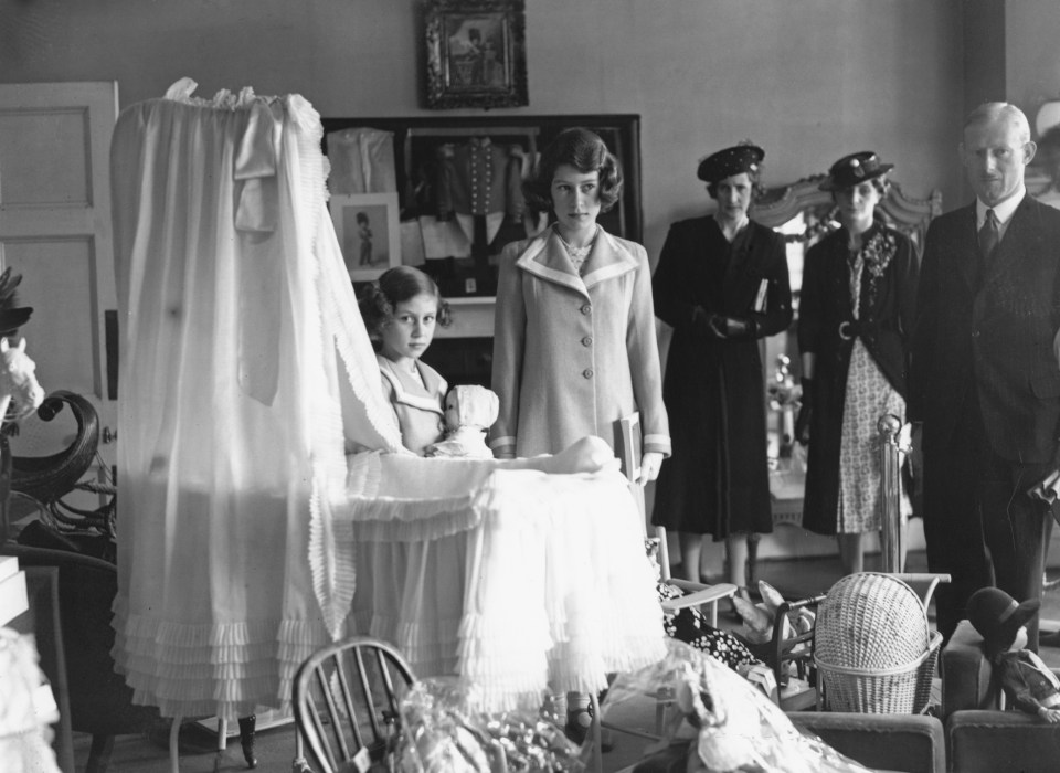 A young Princess Elizabeth with her sister Margaret inside their childhood home