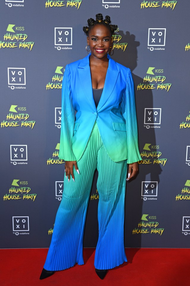 Oti Mabuse wore a blue and green power suit