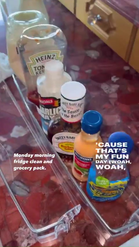 After spraying her fridge shelves, she then re-stocked them with her favourite sauces