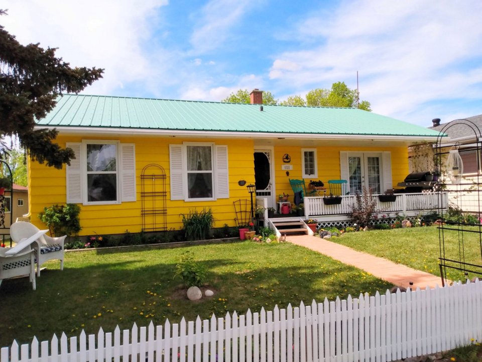 The couple decided to paint their house to stand out from the beige village