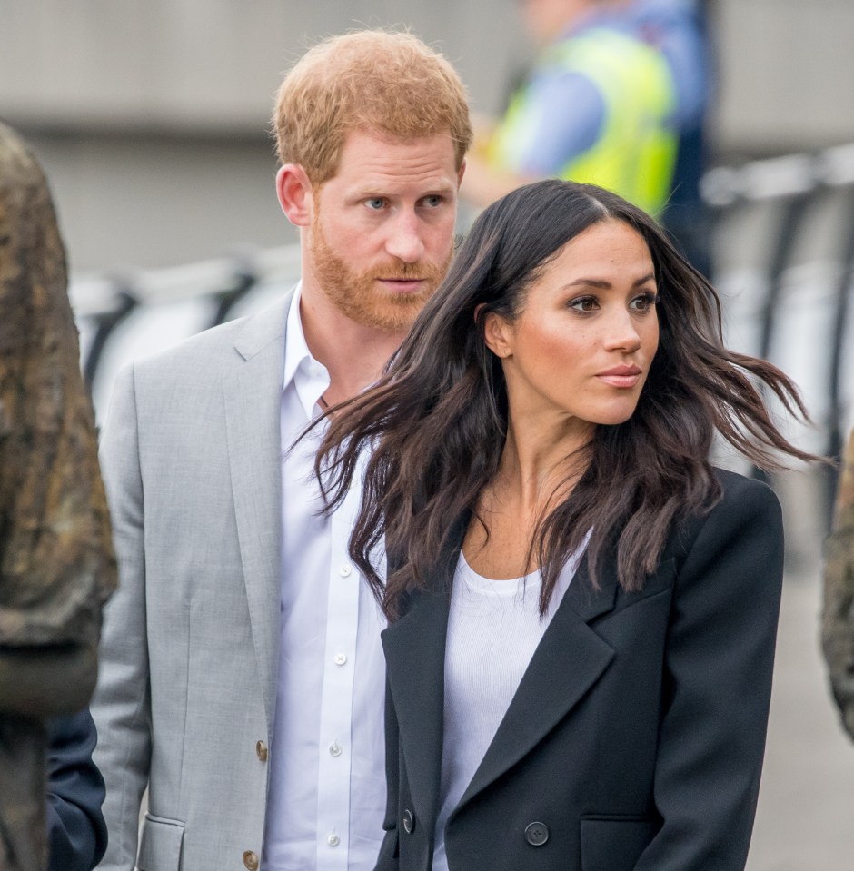 Prince Harry, pictured with Meghan, had to submit his new book more than once before publishers accepted it