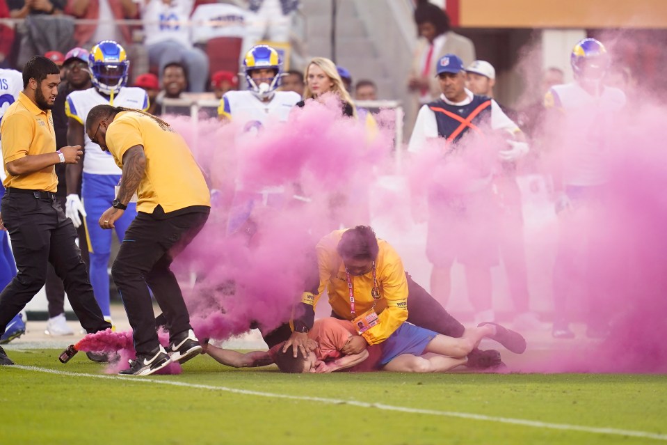 The pitch invader was swiftly dealt with