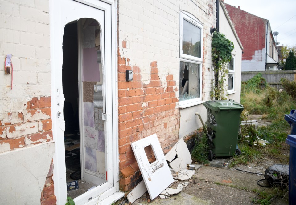 Smashed windows and a broken door after vandalism in the area