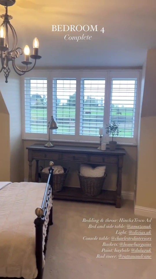 The fourth bedroom features a rustic wooden chest of drawers