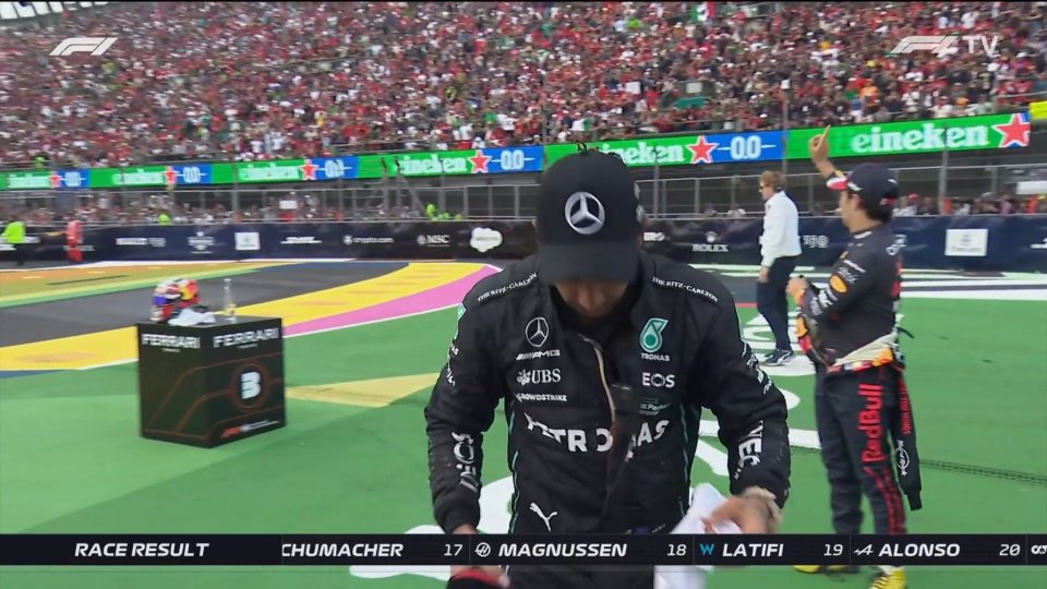 Perez could be seen wagging his finger at the crowd as they boo Hamilton