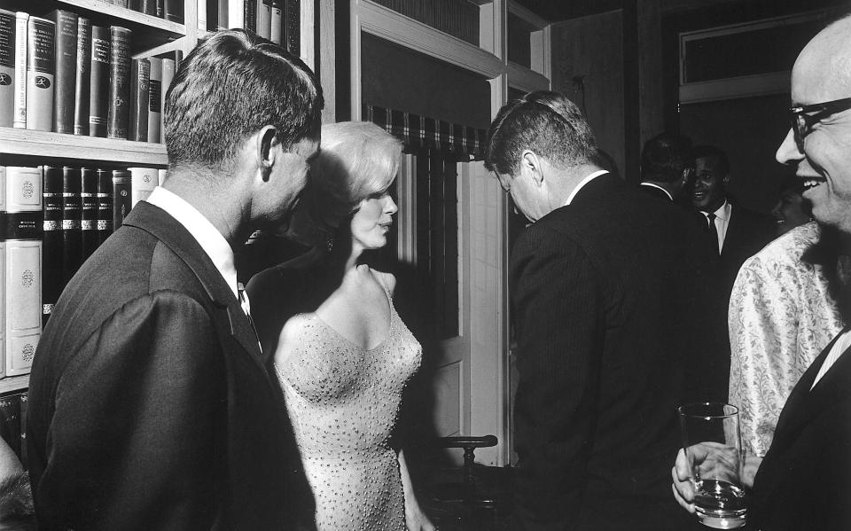 Bobby Kennedy on the left and President John F Kennedy with back turned when Marilyn sang for them