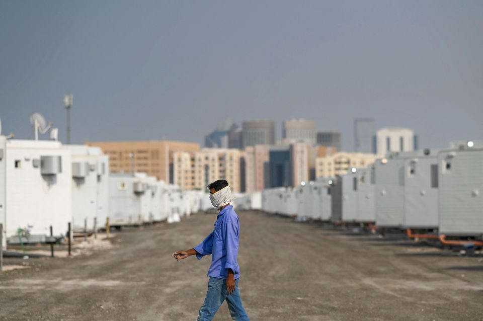 A worker walking at the Caravan City, an ongoing project to host fans during the Qatar 2022 Fifa World Cup