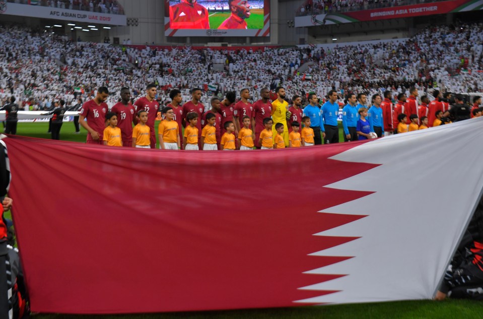 Players of Qatar line up for the national anthem prior to the AFC Asian Cup semi final match between Qatar and United Arab Emirates