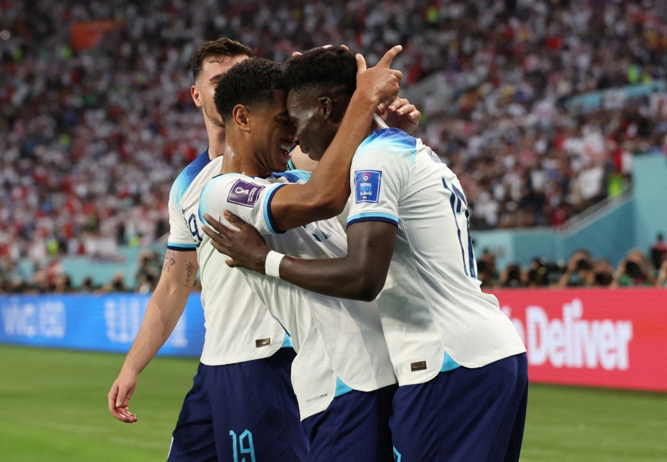 Saka is congratulated for his first-half strike