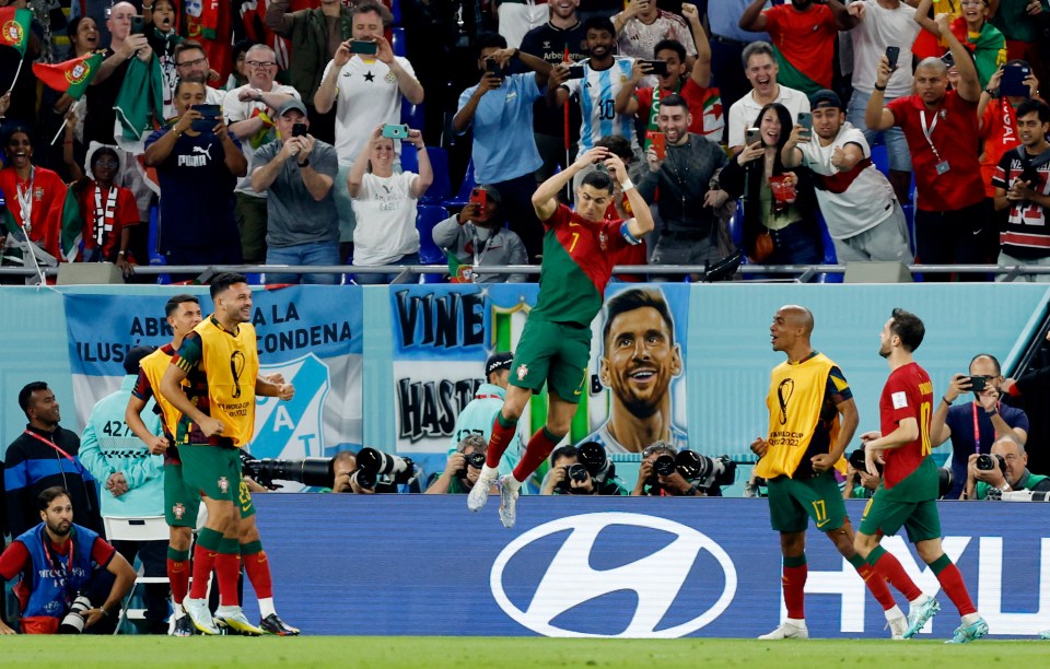 Cristiano Ronaldo celebrates his landmark goal for Portugal by turning a famous celebration into what could be an iconic image - next to a mural of Lionel Messi