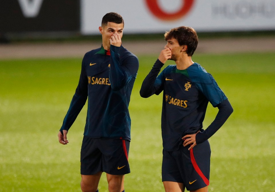 Ronaldo chats with Joao Felix at training