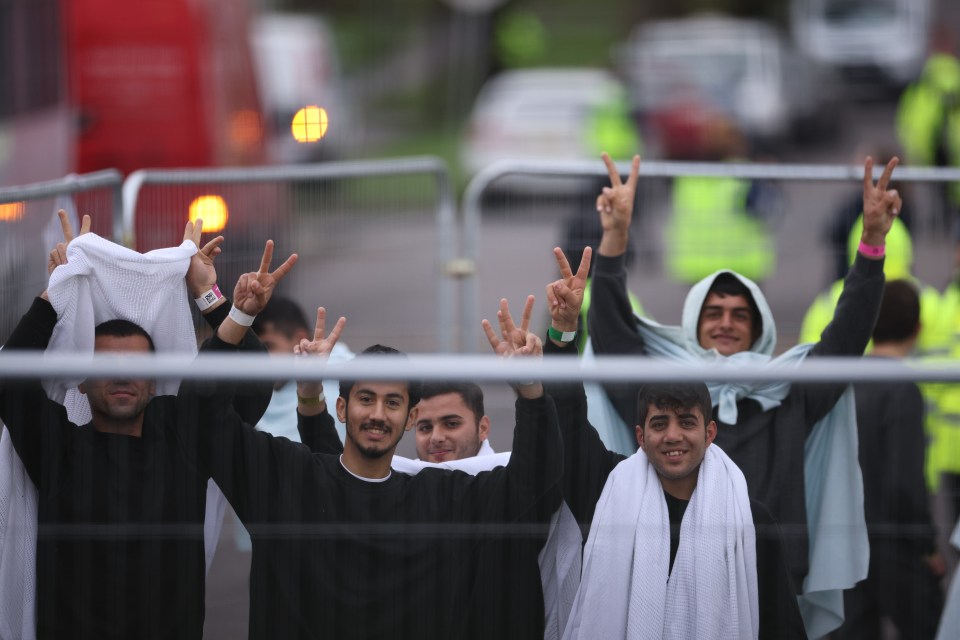 Manston migrants pose for cameras as Suella Braverman arrived for a visit