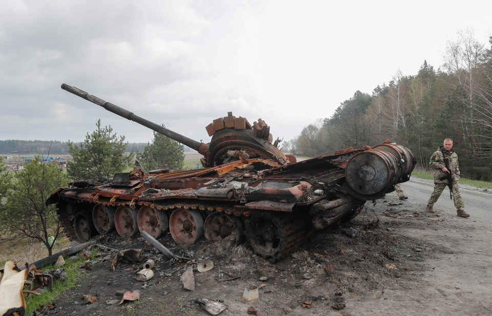 In the east and south of Ukraine Putin’s troops have suffered their worst defeats (pictured: a destroyed Russian tank on the outskirts of Kyiv)