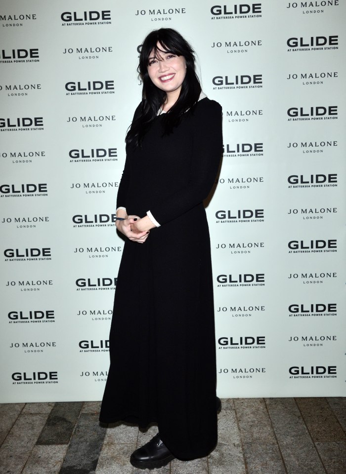 Daisy Lowe cradled her baby bump before saying goodbye to another little bundle of joy