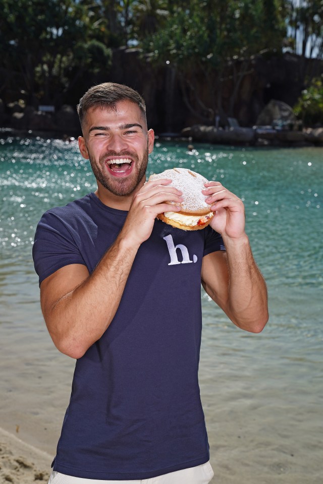 Owen Warner looked delighted as he tucked into a cake after leaving the jungle