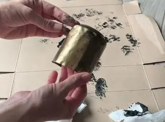 The savvy content creator shows how she transforms leftover fizzy drink cans into faux gold bells - and they look SO much more expensive than they are