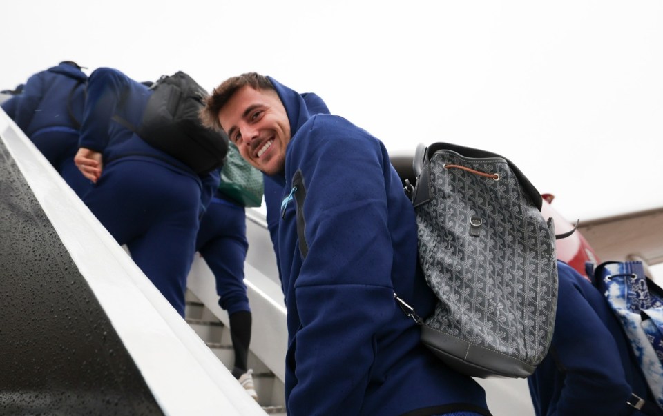 Mason Mount looked cheerful as he boarded the plane